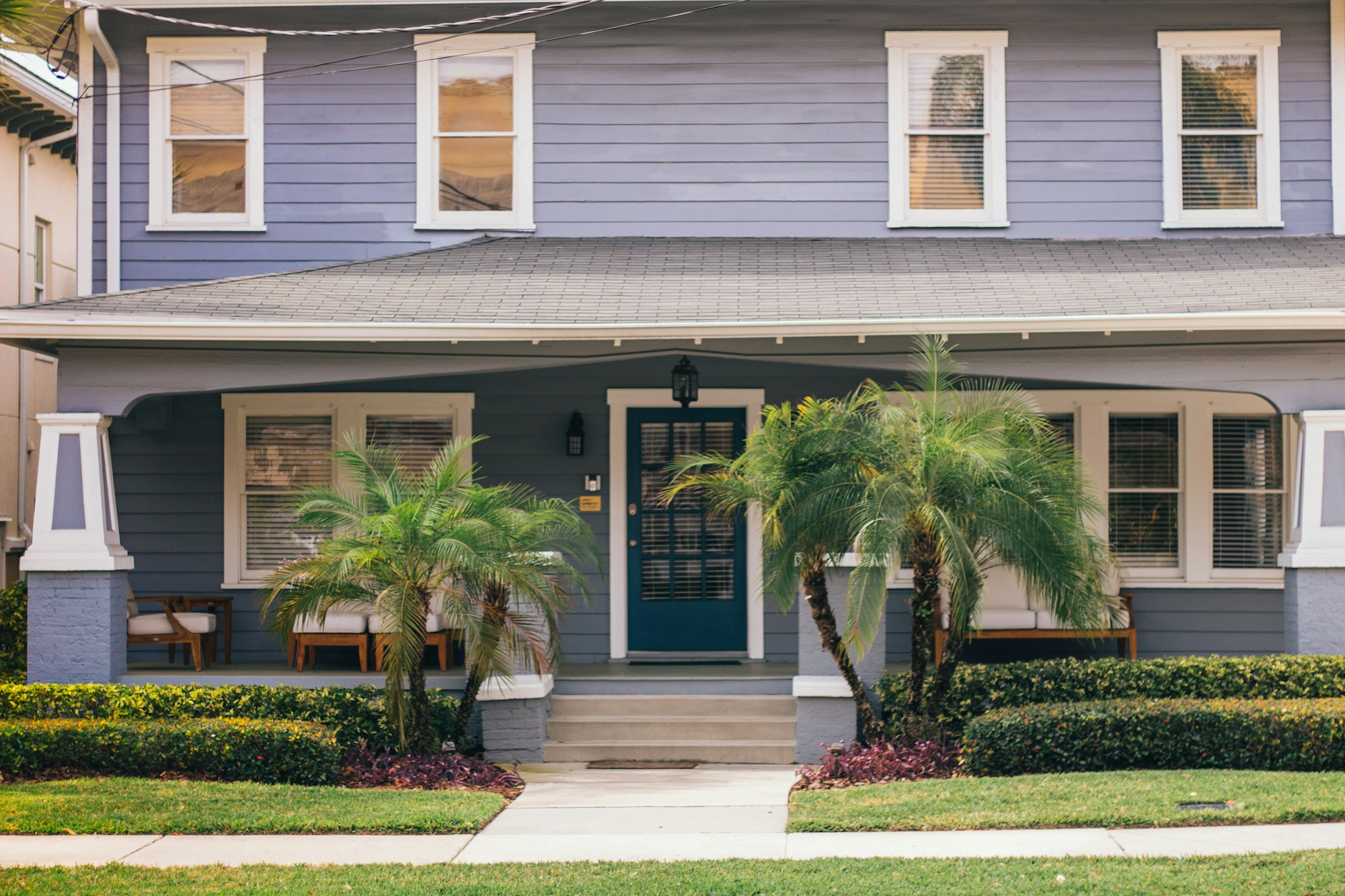 A welcoming home with a porch and landscaped yard